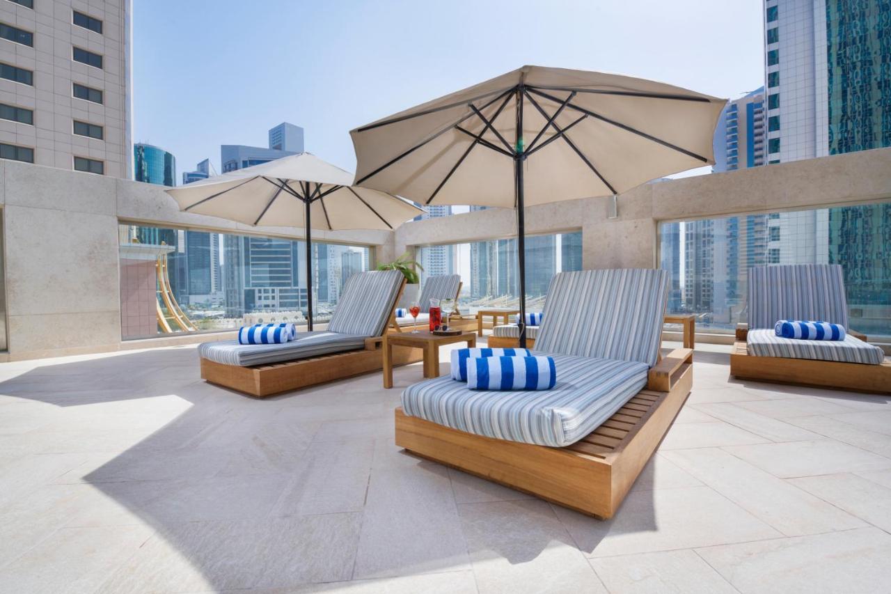 Wyndham Grand Doha West Bay Beach Екстериор снимка The pool deck at the hotel